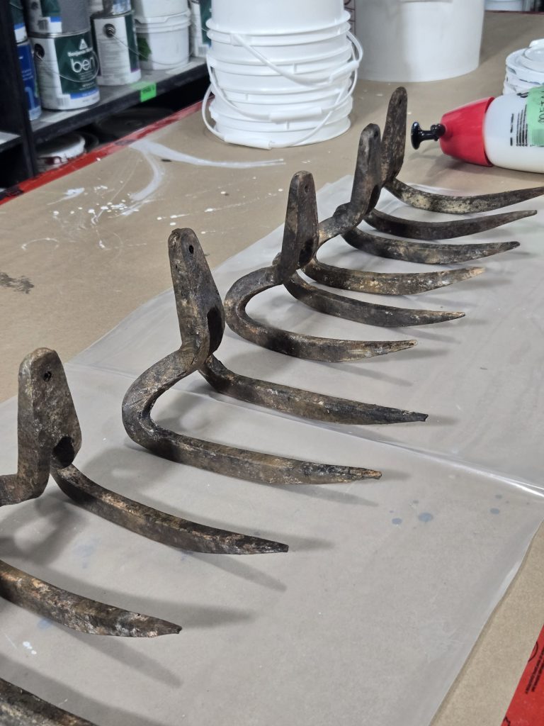 Steel, cast-aluminum and soft-prop gaff hooks with aged finishes