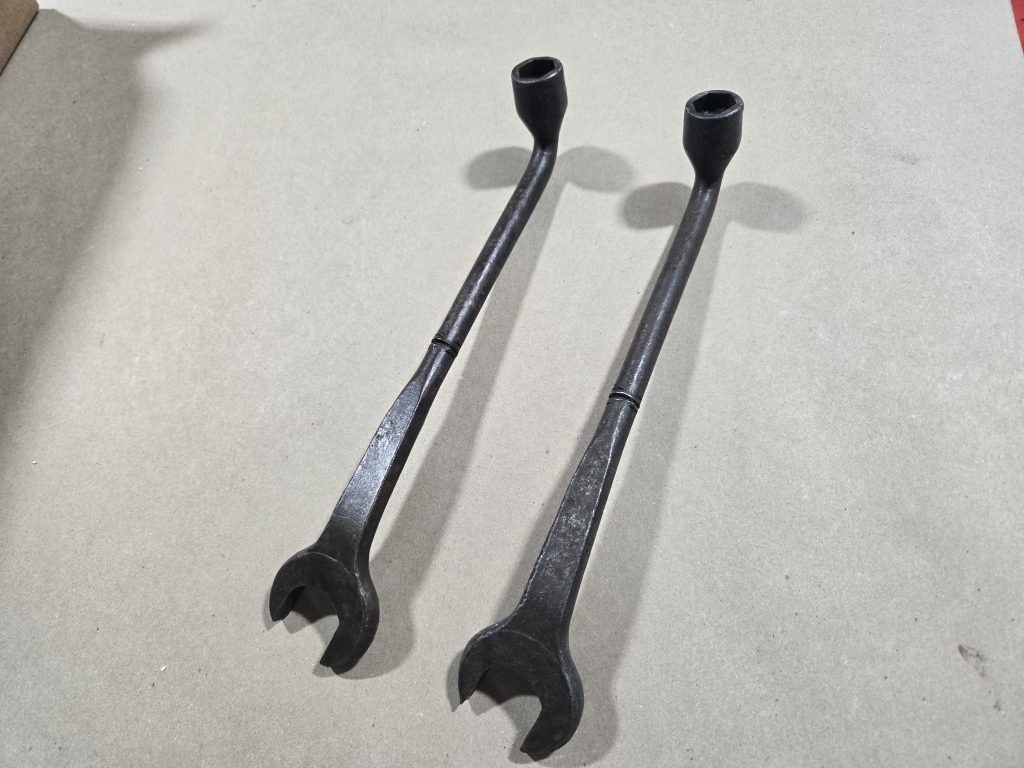 Original wrench beside a matching soft stunt-prop wrench